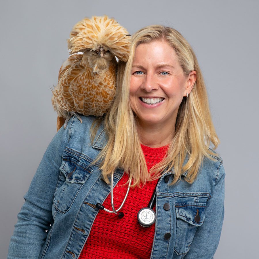 Dr Magnuson 2025 Dr. Magnuson with a chicken on her shoulder